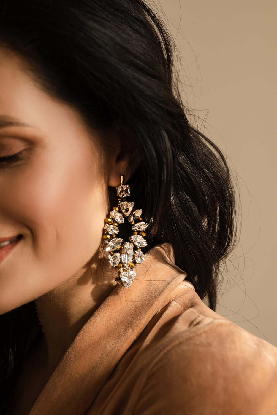 Model wearing handcrafted diamond cluster earrings by Bhakti Diamonds